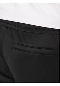 Puma Spodnie dresowe Iconic T7 530098 Czarny Regular Fit. Kolor: czarny. Materiał: bawełna, dresówka
