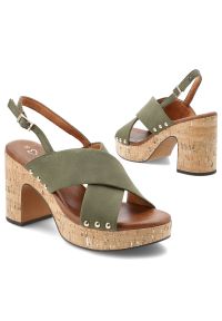 Sandały damskie Marco Tozzi, na wysokim słupku z krzyżowanymi paskami i regulowanym zapięciem przy pięcie osadzone na platformie o korkowym wykończen. Zapięcie: pasek. Kolor: zielony. Materiał: len. Wzór: paski. Sezon: lato. Obcas: na platformie. Styl: elegancki, klasyczny. Wysokość obcasa: średni #6