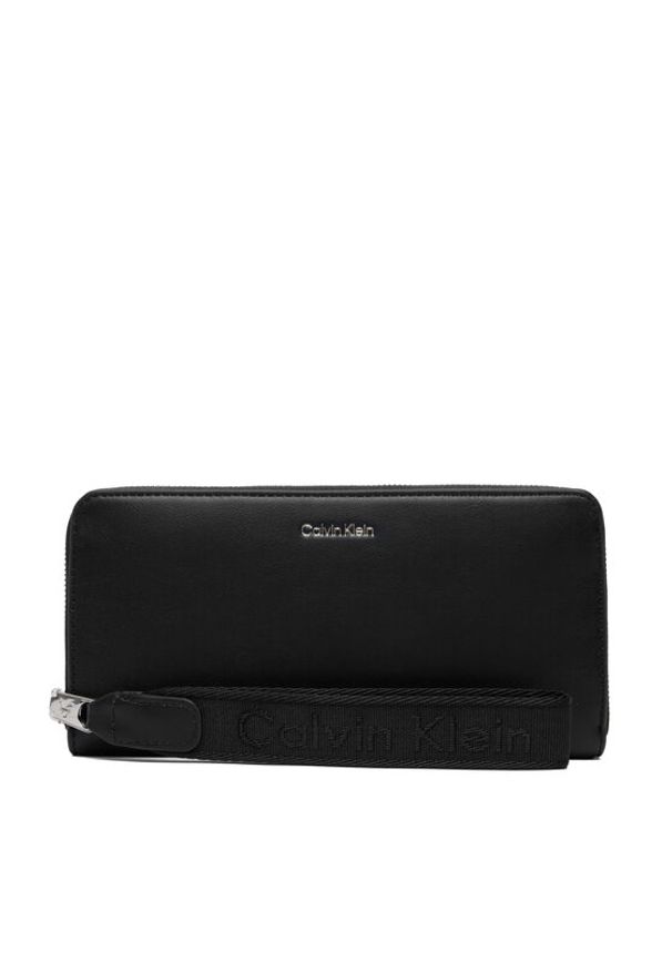 Calvin Klein Portfel Webbing Strap Long Zip Around LV04F1174G Czarny. Kolor: czarny. Materiał: skóra