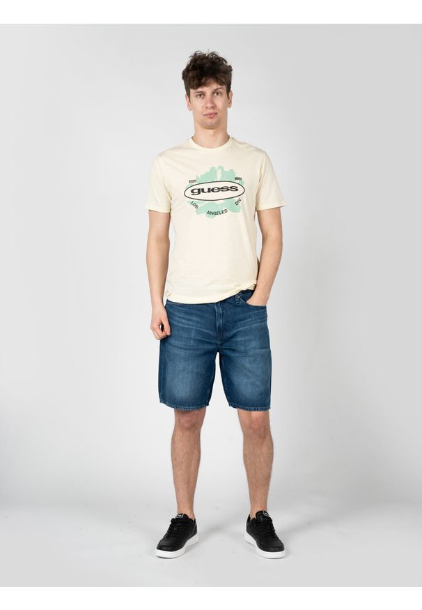 Guess T-Shirt "LA Logo" | M3GI61K9RM1 | Mężczyzna | Żółty. Okazja: na co dzień. Kolor: żółty. Materiał: bawełna. Długość: długie. Wzór: nadruk. Styl: elegancki, casual
