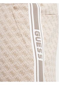 Guess Spodnie dresowe Z5BB19 K2042 Niebieski Regular Fit. Kolor: niebieski. Materiał: syntetyk