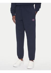 Calvin Klein Jeans Spodnie dresowe Monologo LV047B235G Granatowy Regular Fit. Kolor: niebieski. Materiał: bawełna #1