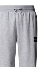 The North Face Spodnie dresowe Fine NF0A8C1K Szary Tapered Fit. Kolor: szary. Materiał: syntetyk
