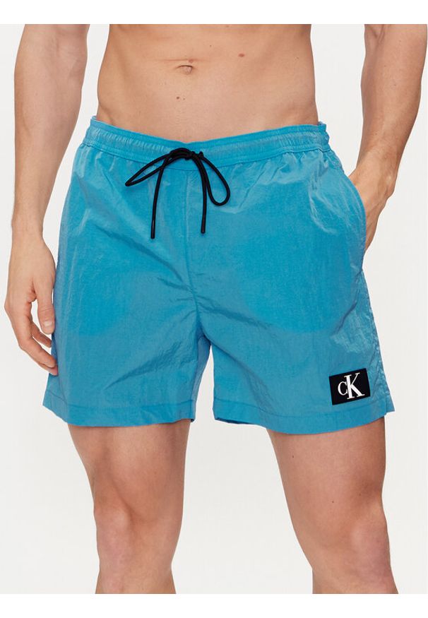 Calvin Klein Swimwear Szorty kąpielowe KM0KM00980 Niebieski Regular Fit. Kolor: niebieski. Materiał: syntetyk
