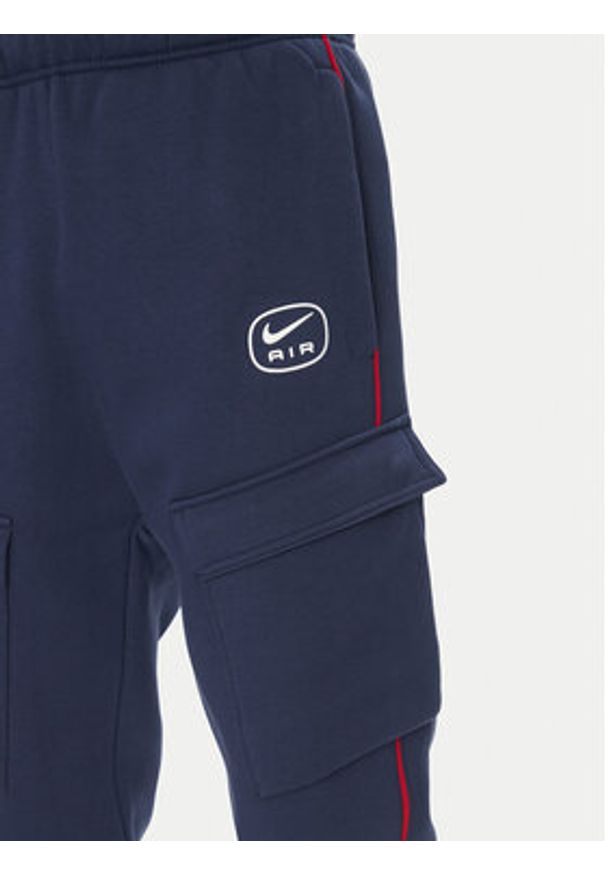 Nike Spodnie dresowe HM0180 Granatowy Regular Fit. Kolor: niebieski. Materiał: bawełna