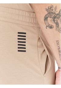 EA7 Emporio Armani Spodnie dresowe 8NPP67 PJVRZ U6155 Beżowy Regular Fit. Kolor: beżowy. Materiał: bawełna