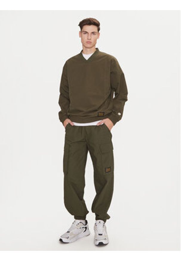 Champion Spodnie dresowe 220415 Zielony Loose Fit. Kolor: zielony. Materiał: bawełna