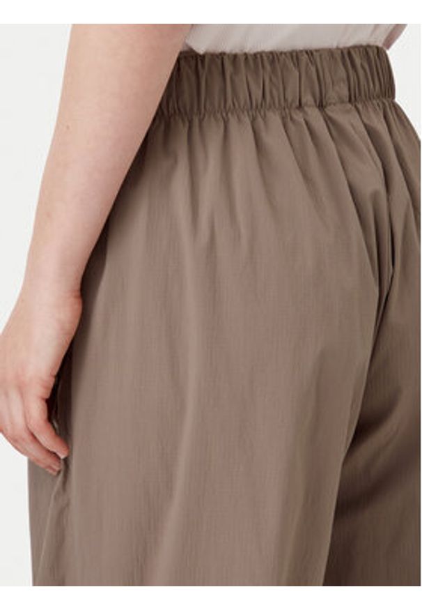 Adidas - adidas Spodnie dresowe Essentials Ripstop JD0783 Beżowy Loose Fit. Kolor: beżowy. Materiał: syntetyk