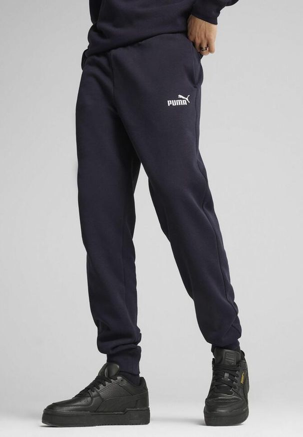 Puma - Męskie spodnie dresowe Essentials z logo No. 1 PUMA New Navy Blue. Kolor: niebieski. Materiał: dresówka