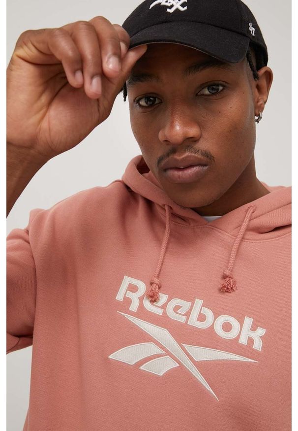 Reebok Classic bluza bawełniana H54460 męska kolor różowy z kapturem z aplikacją. Typ kołnierza: kaptur. Kolor: różowy. Materiał: bawełna. Wzór: aplikacja