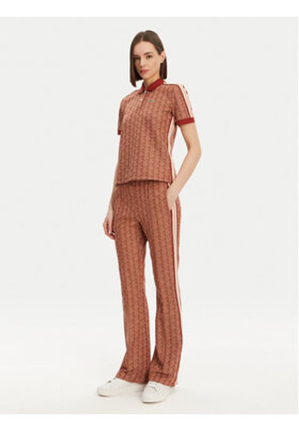 Lacoste Spodnie dresowe XF9313 Pomarańczowy Regular Fit. Kolor: pomarańczowy. Materiał: bawełna