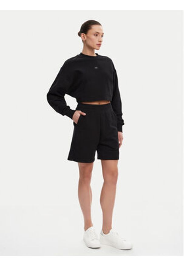 Calvin Klein Jeans Szorty sportowe J20J225221 Czarny Relaxed Fit. Kolor: czarny. Materiał: bawełna