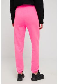 DKNY - Dkny spodnie damskie kolor różowy z nadrukiem. Kolor: różowy. Materiał: dzianina. Wzór: nadruk