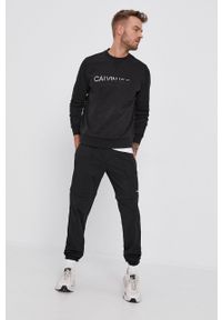 Calvin Klein Jeans Spodnie męskie kolor czarny gładkie. Kolor: czarny. Materiał: dzianina. Wzór: gładki