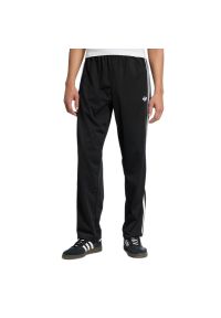 Adidas - Spodnie męskie adidas Originals Firebird KD8315 - czarna. Kolor: czarny. Materiał: dresówka, poliester. Wzór: paski #1