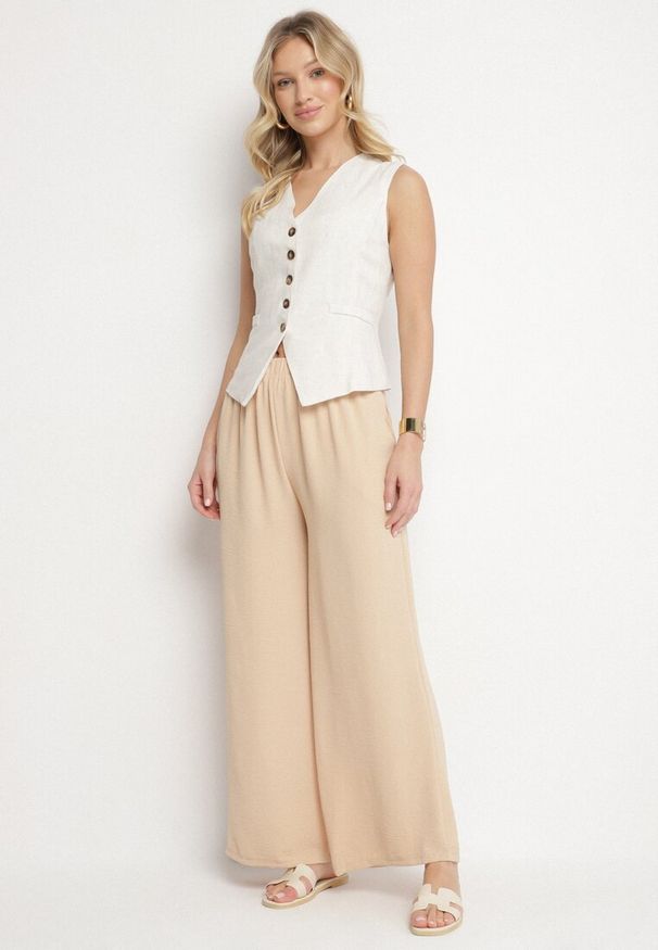Born2be - Beżowe Spodnie Palazzo o Szerokim Kroju z Wysokim Stanem Aravenna. Okazja: na co dzień. Stan: podwyższony. Kolor: beżowy. Wzór: aplikacja. Styl: casual, elegancki