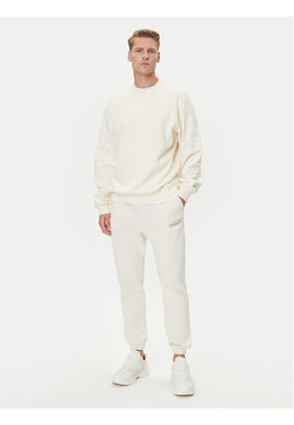 Jack & Jones Spodnie dresowe Kane Billy 12283257 Écru Relaxed Fit. Materiał: syntetyk