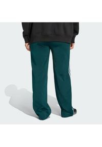 Adidas - adidas Spodnie dresowe Firebird KG3701 Zielony Loose Fit. Kolor: zielony. Materiał: syntetyk #2