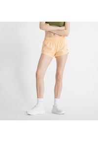 Spodenki damskie New Balance WS41286PAE – pomarańczowe. Kolor: pomarańczowy. Materiał: poliester, materiał. Sport: fitness #1
