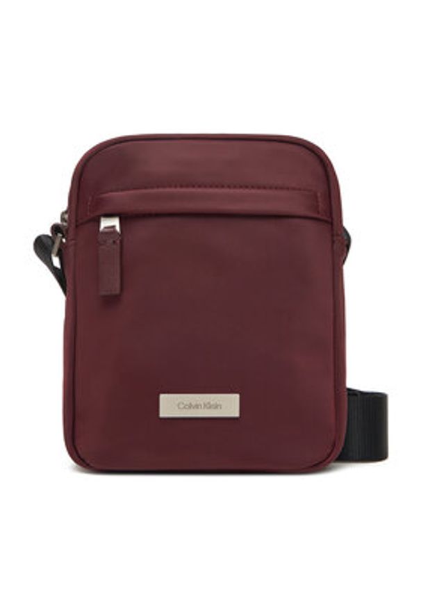Calvin Klein Saszetka Sleek Reporter LV04D3180G Bordowy. Kolor: czerwony. Materiał: materiał