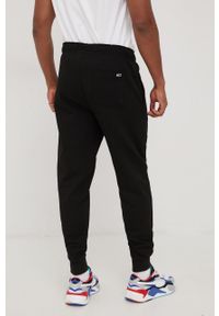 Tommy Jeans spodnie dresowe DM0DM13297BDS.PPYY męskie kolor czarny gładkie. Kolor: czarny. Materiał: dresówka. Wzór: gładki #3