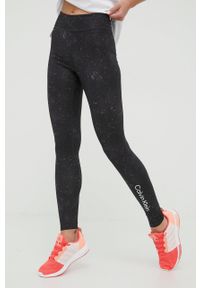 Calvin Klein Performance legginsy treningowe Big Idea damskie kolor czarny wzorzyste. Kolor: czarny. Materiał: materiał, skóra, dzianina