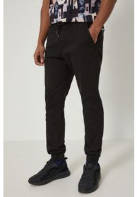 medicine - Medicine Spodnie męskie kolor czarny joggery. Kolor: czarny. Materiał: tkanina. Wzór: gładki