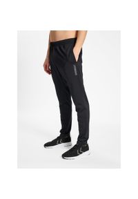 Jogging Hummel TE Strength. Kolor: czarny. Materiał: dresówka. Sport: bieganie
