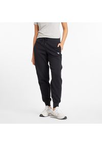 Spodnie damskie New Balance WP43805BK – czarne. Stan: podwyższony. Kolor: czarny. Materiał: poliester, bawełna, dresówka #1
