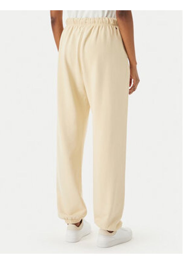 TOMMY HILFIGER - Tommy Hilfiger Spodnie dresowe Logo Embroidery WW0WW49706 Beżowy jasny Regular Fit. Kolor: beżowy. Materiał: bawełna