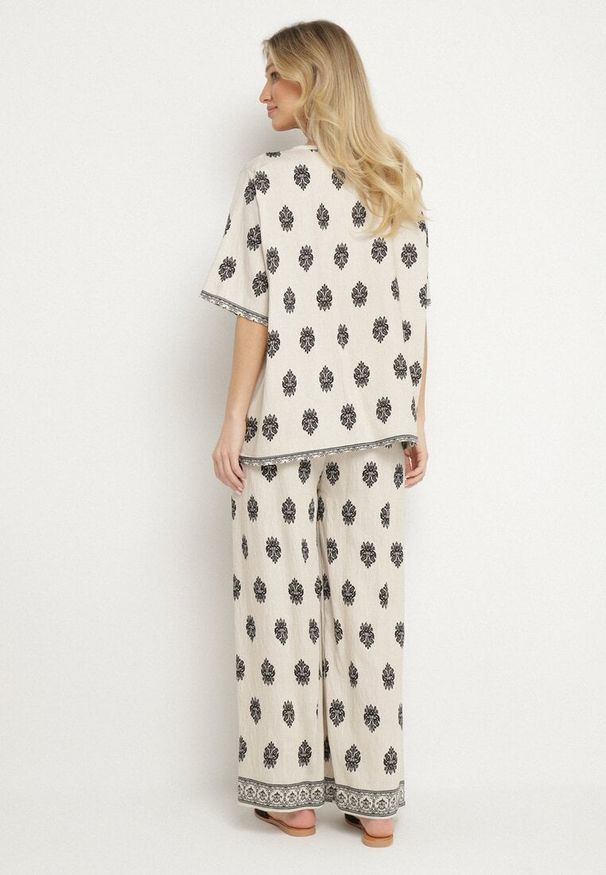 Born2be - Jasnobeżowy Komplet Wiskozowy w Boho Print Bluzka z Krótkim Rękawem i Szerokie Spodnie Natilene. Kolor: beżowy. Materiał: wiskoza. Wzór: nadruk