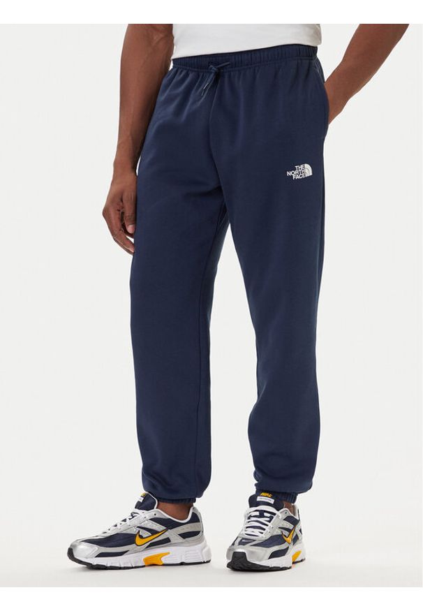 The North Face Spodnie dresowe Simple Dome NF0A8C1W Granatowy Regular Fit. Kolor: niebieski. Materiał: syntetyk