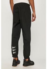 Reebok - Spodnie. Kolor: czarny. Materiał: tkanina #4