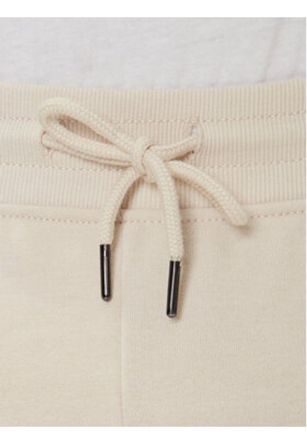 TOMMY HILFIGER - Tommy Hilfiger Spodnie dresowe UM0UM03664 Écru Regular Fit. Materiał: bawełna