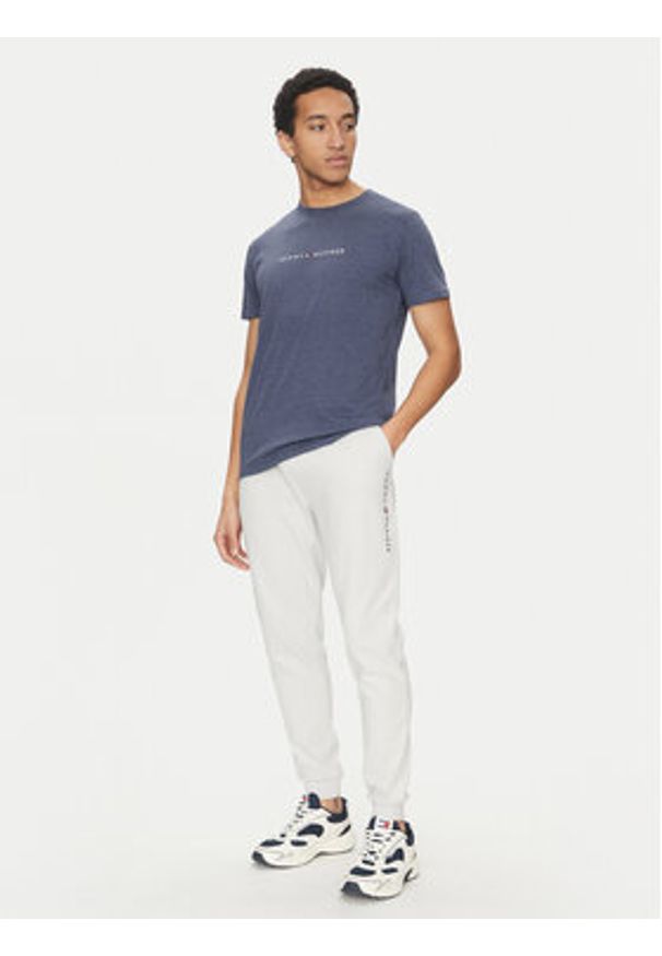 TOMMY HILFIGER - Tommy Hilfiger Spodnie dresowe UM0UM03348 Beżowy Regular Fit. Kolor: beżowy. Materiał: bawełna