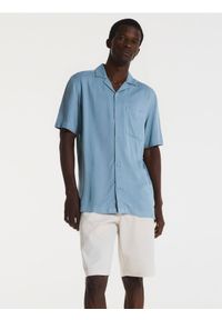 Reserved - Szorty regular fit - beżowy. Kolor: beżowy. Materiał: bawełna, tkanina #1