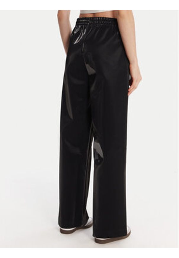 Adidas - adidas Spodnie dresowe adicolor Holiday JV7503 Czarny Loose Fit. Kolor: czarny. Materiał: wiskoza