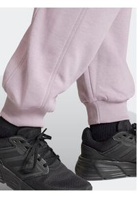 Adidas - adidas Spodnie dresowe ALL SZN IW1283 Fioletowy Loose Fit. Kolor: fioletowy. Materiał: bawełna