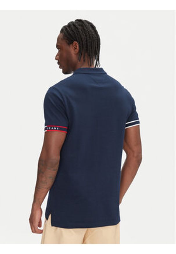 Tommy Jeans Polo Flag Cuff DM0DM21306 Granatowy Slim Fit. Typ kołnierza: polo. Kolor: niebieski. Materiał: bawełna