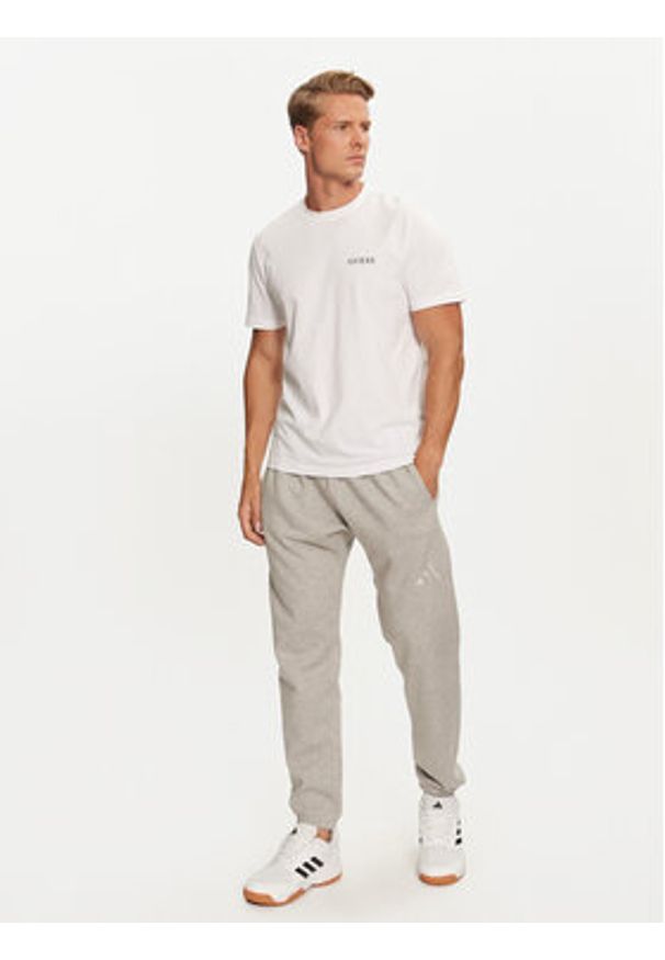 Adidas - adidas Spodnie dresowe ALL SZN Fleece IY4148 Szary Regular Fit. Kolor: szary. Materiał: bawełna, syntetyk