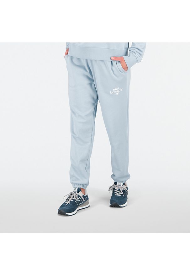 Spodnie damskie New Balance WP31508LAY – niebieskie. Kolor: niebieski. Materiał: bawełna, dresówka, poliester