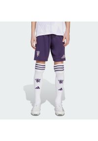Adidas - Szorty Manchester United 25/26 Away Kids. Kolor: fioletowy. Sport: piłka nożna