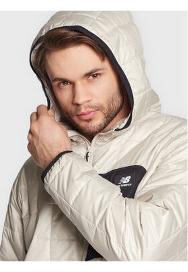 New Balance Kurtka przejściowa MJ23502 Beżowy Relaxed Fit. Kolor: beżowy. Materiał: syntetyk