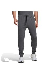 Adidas - Spodnie męskie adidas Essentials Fleece Regular Tapered. Kolor: szary