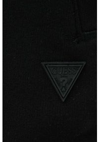 Guess spodnie dresowe kolor czarny melanżowe. Kolor: czarny. Materiał: dresówka. Wzór: melanż #2