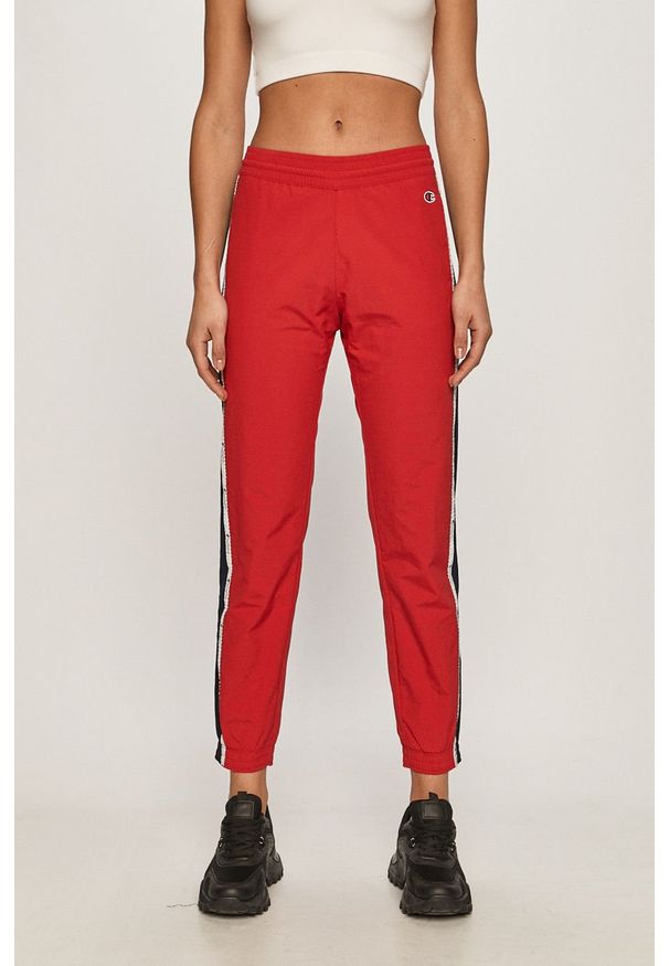 Champion - Spodnie. Kolor: czerwony. Materiał: tkanina, poliester, poliamid. Wzór: gładki