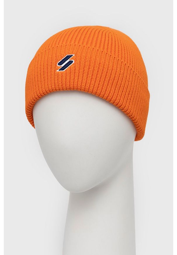 Superdry Czapka bawełniana kolor pomarańczowy z grubej dzianiny. Kolor: pomarańczowy. Materiał: bawełna, dzianina
