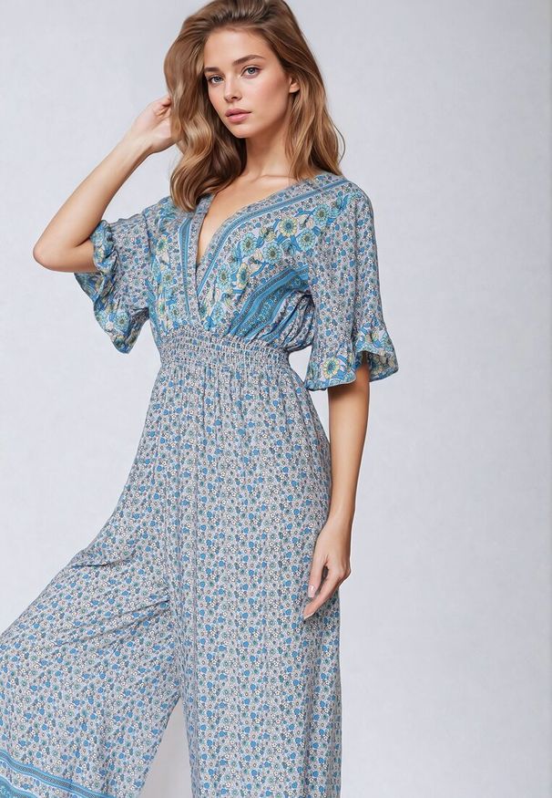 Born2be - Niebieski Bawełniany Kombinezon z Gumkami w Pasie i Kopertowym Dekoltem Zapinany z Tyłu na Guziki Lorrania. Okazja: na co dzień. Kolor: niebieski. Materiał: bawełna. Długość rękawa: krótki rękaw. Długość: krótkie. Styl: wizytowy, casual, elegancki