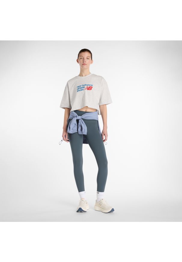 Legginsy damskie do biegania New Balance Sleek WP51268GT – szare. Stan: podwyższony. Kolor: szary. Materiał: lycra, poliester, materiał. Wzór: gładki. Sport: fitness