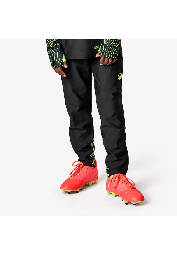 KIPSTA - Spodnie piłkarskie dla dzieci Kipsta Viralto Wavy. Kolor: żółty, czarny, wielokolorowy, zielony. Materiał: poliester, materiał, elastan. Sport: piłka nożna